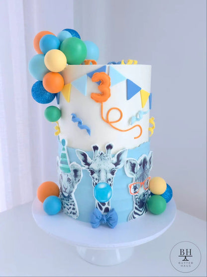 Party Animals birthday cake with pastel balloon cluster and cardstock safari animal cutouts