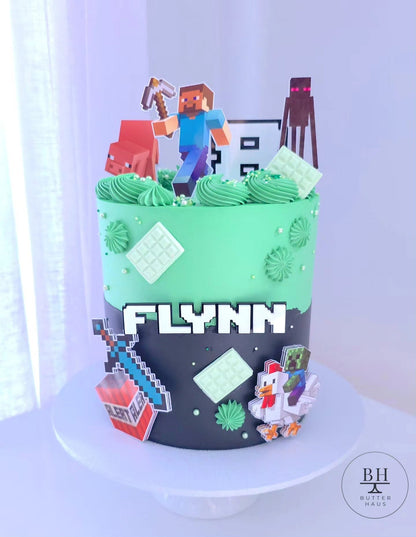 Minecraft Adventure birthday cake with grass-green and cave-black buttercream and Minecraft character toppers