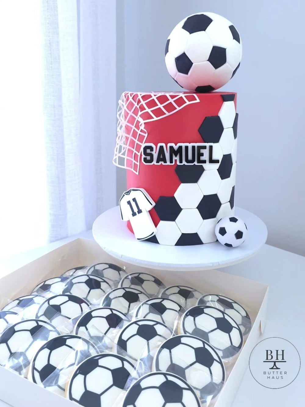 Soccer Ball cookies with a matching soccer themed birthday cake