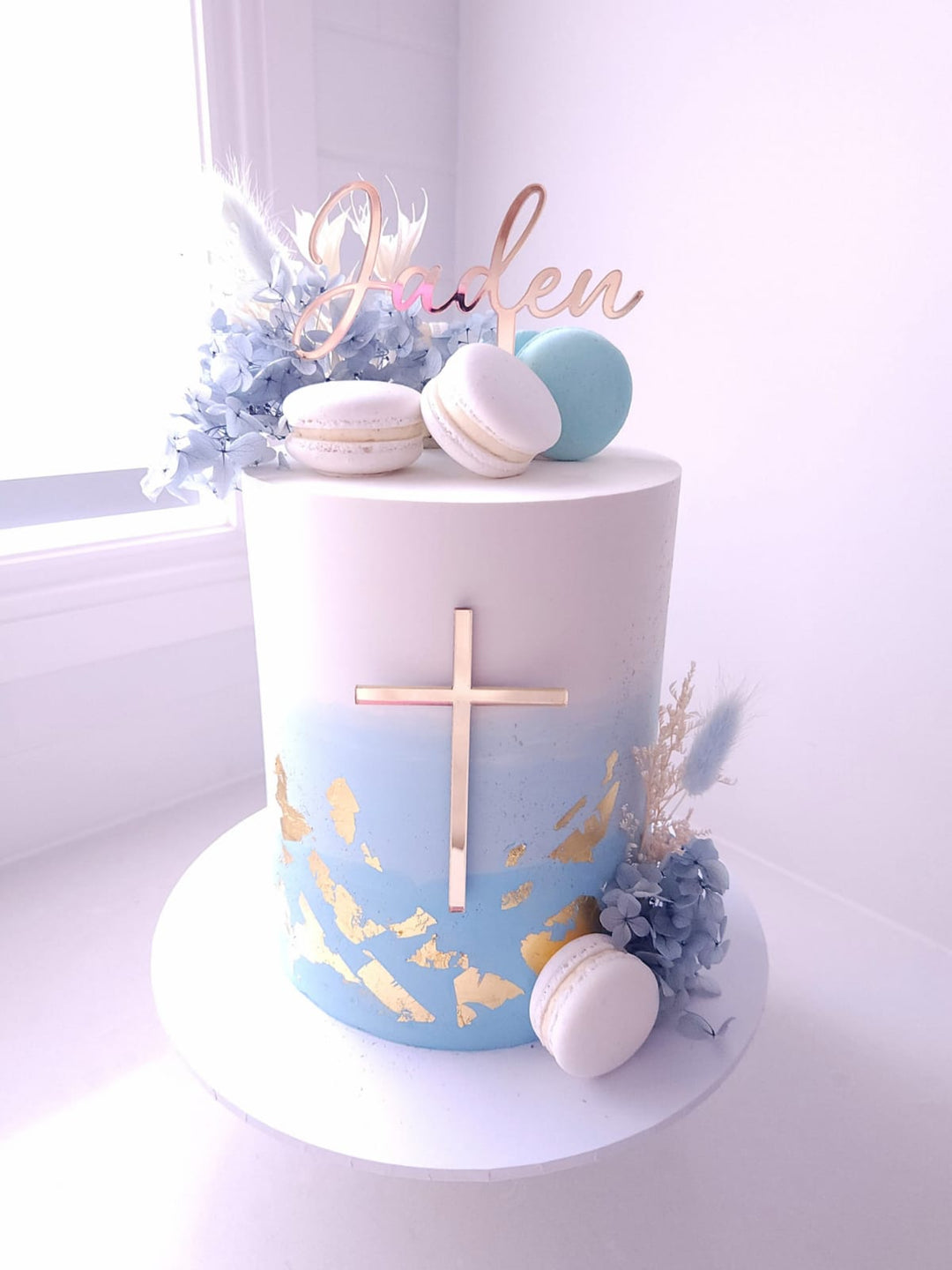 Sweet Blessings christening cake in ombre buttercream with macarons, gold leaf and dried florals