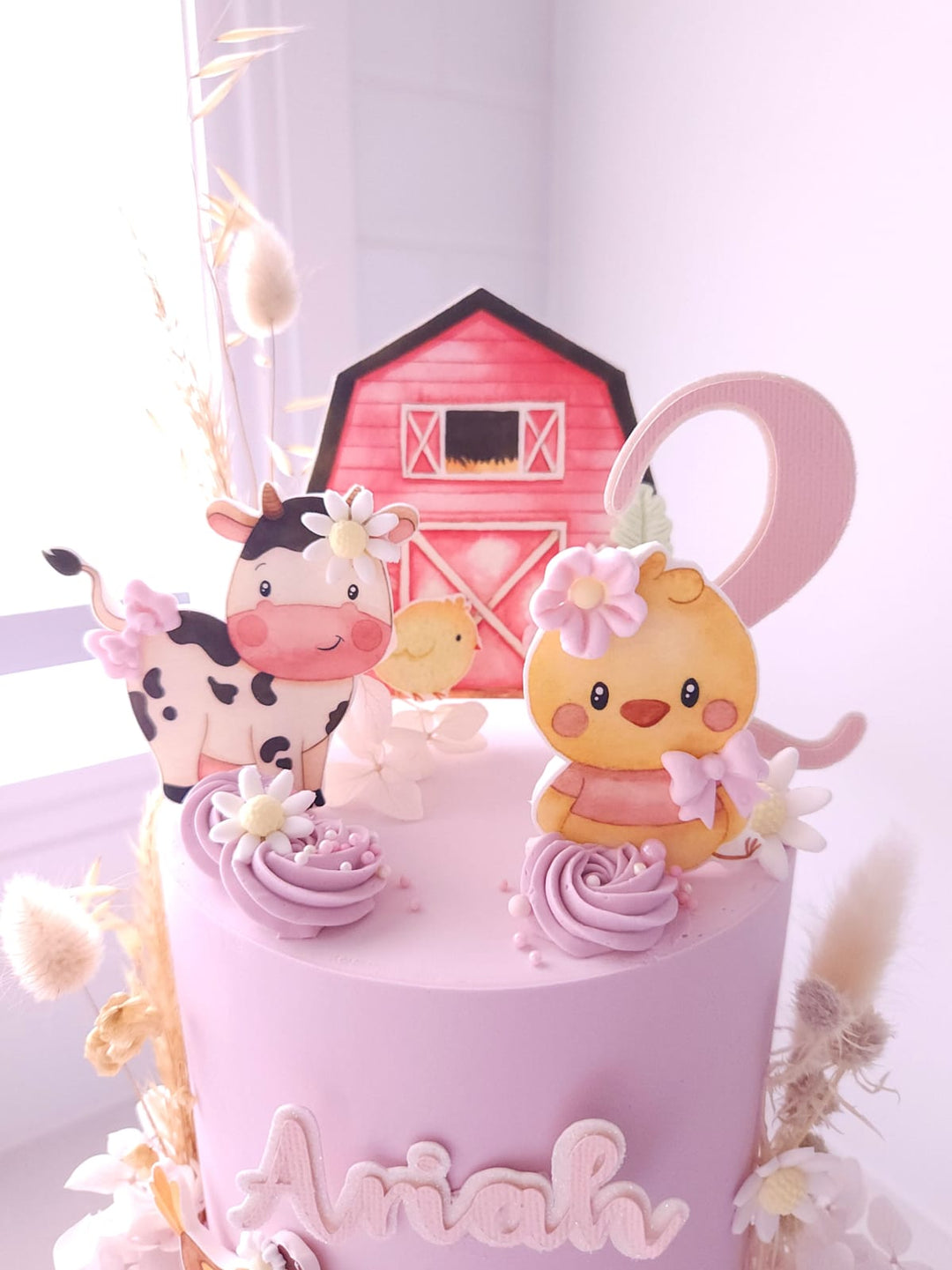 Little Farm Friends cake styled for a first birthday celebration