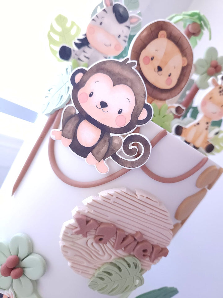 Side view of Little Wild One birthday cake with custom name plaque