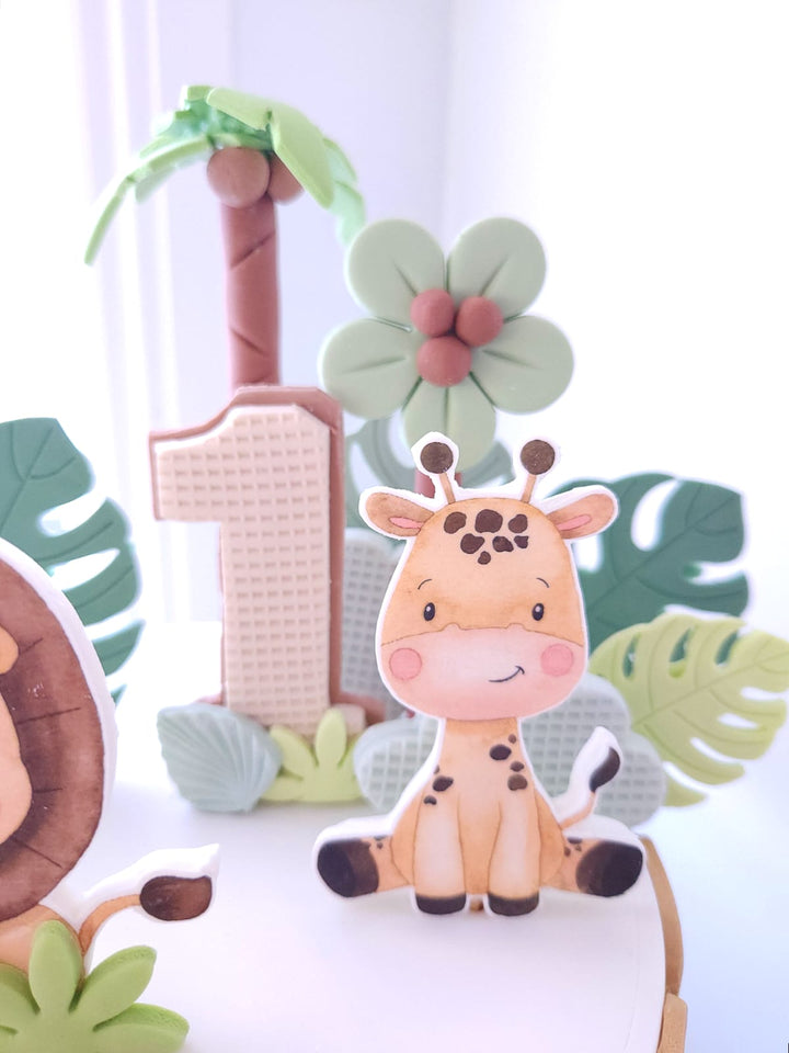 Little Wild One cake styled in soft neutral jungle tones