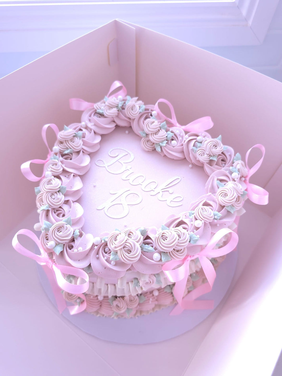 Lambeth Heart Cake with traditional over-piped swags, garlands and shell borders on fully piped sides